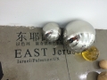 Qiu Zhijie, Playground, 2014, Mixed media installation: 300 stainless steel, glass and wooden balls in variable sizes (diameter from 6 to 50 cm), adhesive black tape map and lettering, Variable size, | Adhesive lettering: East Jerusalem: Israel/Palestine/UN Lettering on balls: TERRORISM, COMPROMISE, ENLIGHTENMENT 